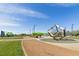 Community playground featuring modern play equipment, open green spaces, and walking paths for Gathering enjoyment at 7364 Marbury St, Las Vegas, NV 89166