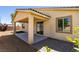 Exterior backyard view featuring the patio, walkway, and desert landscaping at 768 Flowing Meadow Dr, Henderson, NV 89014