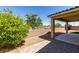 Backyard featuring rock landscaping, a covered patio, and a brick-paved walkway at 768 Flowing Meadow Dr, Henderson, NV 89014
