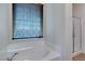 Relaxing bathroom with soaking tub and separate glass enclosed shower at 768 Flowing Meadow Dr, Henderson, NV 89014