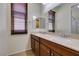 Bright bathroom with double vanity sinks, granite countertops, and modern fixtures at 768 Flowing Meadow Dr, Henderson, NV 89014