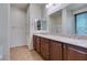 Stylish bathroom featuring dual sinks, and a large mirror, perfect for your morning routine at 768 Flowing Meadow Dr, Henderson, NV 89014