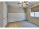 Neutral carpeted bedroom with decorative wall accent and window providing natural light at 768 Flowing Meadow Dr, Henderson, NV 89014