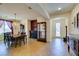 Dining room featuring a fireplace, chandelier, and arched doorway to entry at 768 Flowing Meadow Dr, Henderson, NV 89014