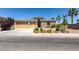 Charming single-story home featuring a well-manicured lawn and a three-car garage at 768 Flowing Meadow Dr, Henderson, NV 89014