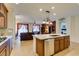 Open concept kitchen and living area featuring granite countertops and stainless steel appliances at 768 Flowing Meadow Dr, Henderson, NV 89014