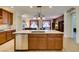 Stylish kitchen island with granite countertops, stainless steel dishwasher and bar seating at 768 Flowing Meadow Dr, Henderson, NV 89014