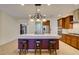 Spacious kitchen features granite countertops, stainless steel appliances, and a large island with seating at 768 Flowing Meadow Dr, Henderson, NV 89014
