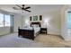 Main bedroom with modern ceiling fan, decorative headboard and a carpeted floor at 768 Flowing Meadow Dr, Henderson, NV 89014