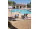 Gated community pool area with lounge chairs, offering a secure and relaxing environment at 833 Aspen Peak Loop # 2511, Henderson, NV 89011