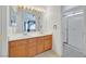 Bathroom with double sinks, white countertops, and a glass-enclosed shower at 851 Offerman Ave, Las Vegas, NV 89123