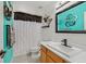 Bathroom with modern decor, a white vanity and colorful wall art at 851 Offerman Ave, Las Vegas, NV 89123