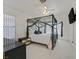 Bright bedroom with a modern canopy bed and neutral decor at 851 Offerman Ave, Las Vegas, NV 89123
