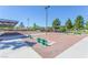 Community bocce ball court featuring benches, shade canopies, and well-maintained landscaping at 851 Offerman Ave, Las Vegas, NV 89123