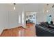 Inviting entrance to home showcasing hardwood floors and open floor plan to adjacent office and living areas at 851 Offerman Ave, Las Vegas, NV 89123