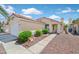 Well-maintained single-story home with a tiled roof, desert landscaping, and a welcoming entrance at 851 Offerman Ave, Las Vegas, NV 89123