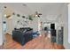 Open-concept living area with hardwood floors, fireplace, modern decor, and an adjacent dining area at 851 Offerman Ave, Las Vegas, NV 89123