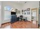 Home office with hardwood floors, large windows, and modern desk setup for productivity at 851 Offerman Ave, Las Vegas, NV 89123