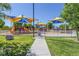 Colorful playground with multiple play structures, offering a fun and safe environment for children at 851 Offerman Ave, Las Vegas, NV 89123