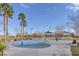 Community splash pad surrounded by picnic areas, palm trees, and beautiful landscaping at 851 Offerman Ave, Las Vegas, NV 89123
