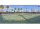 Outdoor tennis courts with views of palm trees, providing a great space for sports and recreation at 851 Offerman Ave, Las Vegas, NV 89123