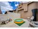 Backyard patio featuring an inflatable pool, and comfortable seating, perfect for relaxation at 9431 Borough Park St, Las Vegas, NV 89178