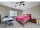Bedroom with a ceiling fan and a window providing natural light at 9431 Borough Park St, Las Vegas, NV 89178