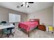 Bedroom featuring a window, ceiling fan and desk at 9431 Borough Park St, Las Vegas, NV 89178