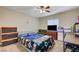 Bedroom with ceiling fan and natural light, complete with personal touches and comfortable decor at 9431 Borough Park St, Las Vegas, NV 89178