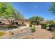 Peaceful community park featuring winding walkways, cozy benches, and lush landscaping at 9431 Borough Park St, Las Vegas, NV 89178