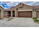 Charming single-story home with a two-car garage and beautiful desert landscaping at 9431 Borough Park St, Las Vegas, NV 89178