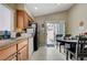 Eat-in kitchen area with tile floors and sliding glass door to the patio at 9431 Borough Park St, Las Vegas, NV 89178