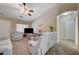 Comfortable living room with carpet floors and a ceiling fan at 9431 Borough Park St, Las Vegas, NV 89178