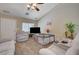 Comfortable living room with an open layout, ceiling fan, and neutral decor at 9431 Borough Park St, Las Vegas, NV 89178
