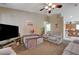 Comfortable living room with plush seating, ceiling fan, and an open layout at 9431 Borough Park St, Las Vegas, NV 89178