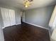 Neutral bedroom featuring double door closet and wood look floors at , Las Vegas, NV 89129