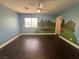 Bright bedroom featuring wood-look floors, natural light, and a whimsical mural at , Las Vegas, NV 89129