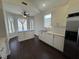 Bright kitchen features stainless steel appliances, white cabinets, and dark floors at , Las Vegas, NV 89129