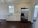 Bright kitchen features stainless steel appliances, white cabinets, and dark floors at , Las Vegas, NV 89129