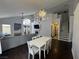 Spacious living and dining area with a gray sectional, white dining table and chairs, and ample natural light at , Las Vegas, NV 89129