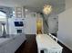 Open concept living room and dining area with high ceilings and a modern chandelier, perfect for entertaining at , Las Vegas, NV 89129