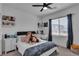 Comfortable bedroom with natural light, desk and a black headboard at 9641 Rankin Ridge Ct, Las Vegas, NV 89178