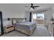 Calm bedroom with a sliding door, a large bed, and neutral walls at 9641 Rankin Ridge Ct, Las Vegas, NV 89178