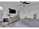Bright bedroom featuring a ceiling fan, TV and a wood dresser at 9641 Rankin Ridge Ct, Las Vegas, NV 89178