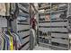 Organized walk-in closet with shelves, drawers, and hanging rods for clothing storage at 9641 Rankin Ridge Ct, Las Vegas, NV 89178
