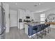Beautiful kitchen featuring an island with bar stool seating, stainless steel appliances, and neutral countertops at 9641 Rankin Ridge Ct, Las Vegas, NV 89178