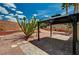Backyard featuring a gazebo, cactus, and desert landscaping at 1012 Vanier Ct, Henderson, NV 89052