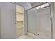 Bathroom showcasing a glass shower and closet with shelving at 1012 Vanier Ct, Henderson, NV 89052