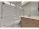 Clean bathroom featuring shower-tub combo, vanity, and tile floors at 1012 Vanier Ct, Henderson, NV 89052