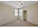 Cozy bedroom featuring neutral carpet, closet, and a ceiling fan at 1012 Vanier Ct, Henderson, NV 89052